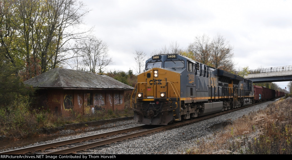 CSX 3408 leads a consist of HERZOG hoppers east at TL's MP 50